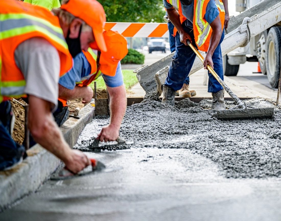 Crew finishing a concrete pour