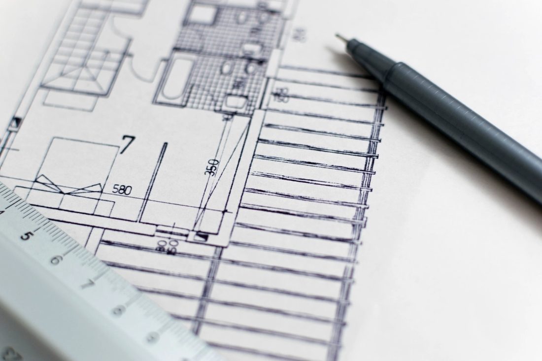 Floor plan with pen and scale rule