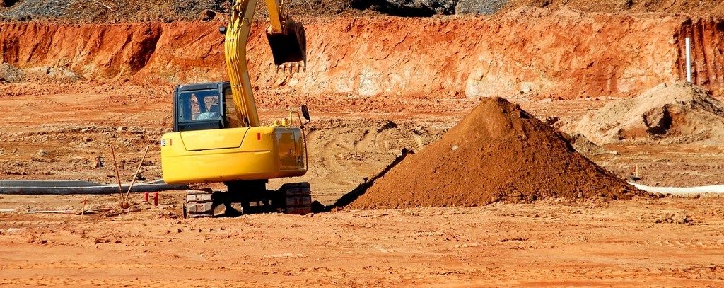 Excavator digging on a work site